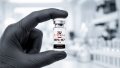 Gloved researcher holding an Everwell BPC-157 research vial