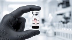 Gloved laboratory researcher holding an Everwell BPC-157 vial